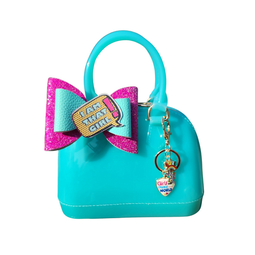 Turquoise handbag with a large bow and keychain on a white background